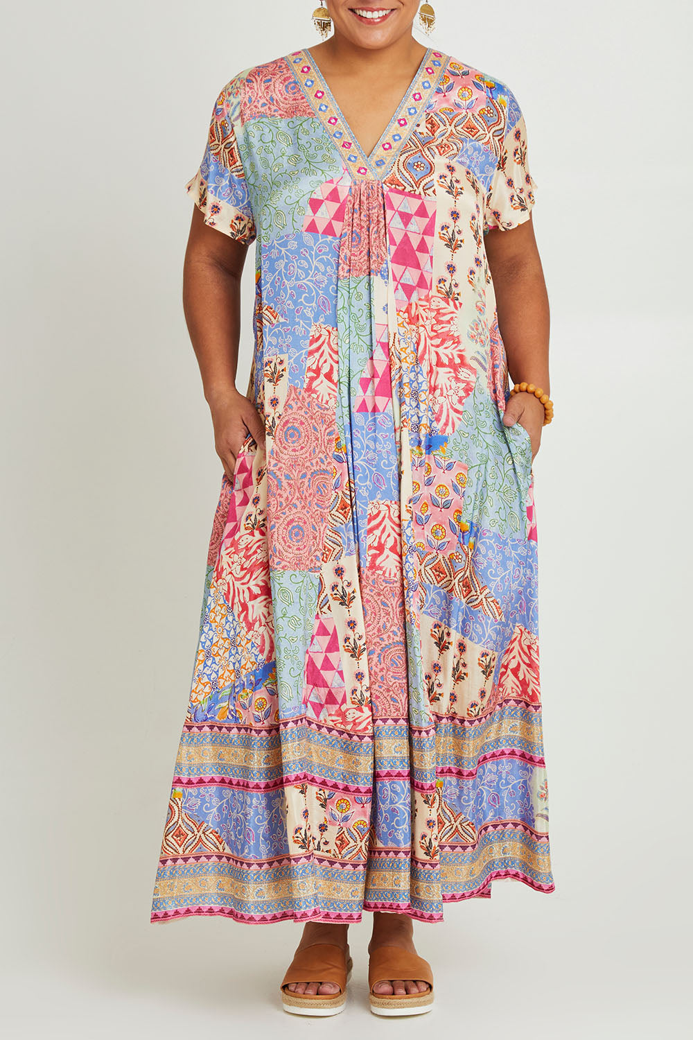 Model Ashleigh wearing size 16 of the Mindil Beach Maxi Dress in colour Patchwork, from the front, cropped image