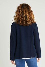 Model Emma wearing size S of the Blazer in colour Navy (Blue), from the back
