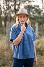 A model wearing the Button Thru Vest in colour Denim (Blue), from the front, showing the whole outfit