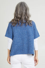 Model Luisa wearing size S of the Button Thru Vest in colour Denim (Blue), from the back