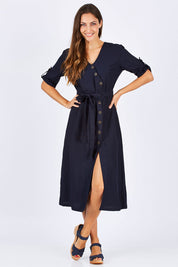 Model Anna wearing size 10 of the Button Detailed Mid Length Dress in colour Navy (Blue), from the front, showing the whole outfit