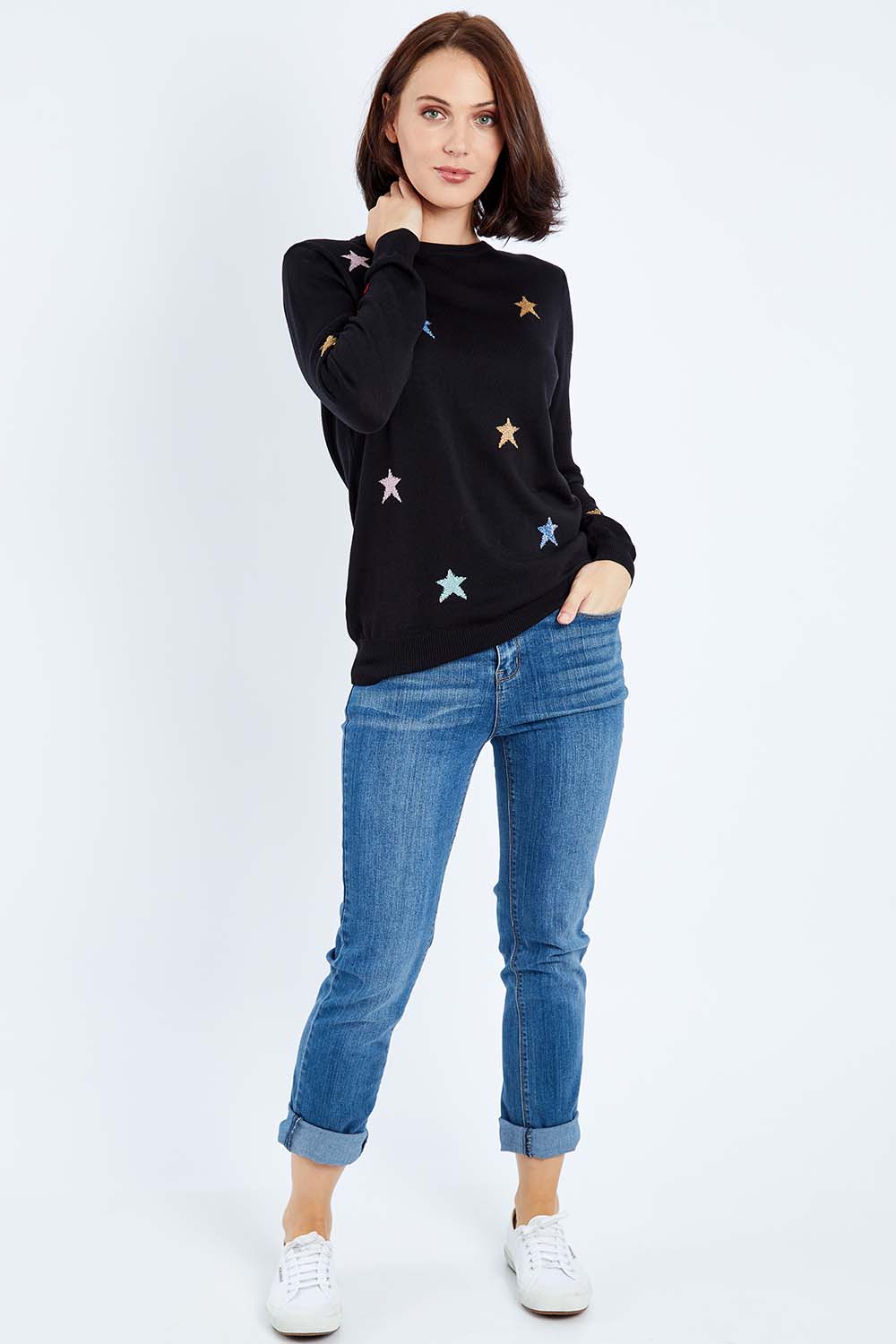Model Andrea wearing size 10 of the Rita Starburst Sweater in colour Blackmulti (Black), from the front, showing the whole outfit