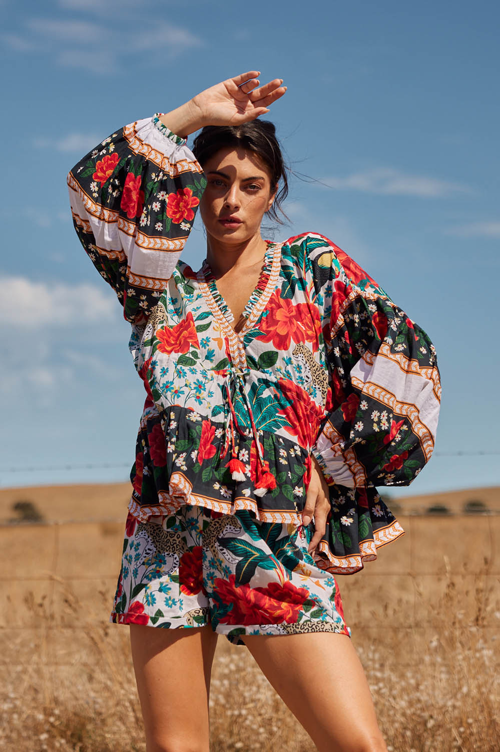 A model wearing the Cha Cha Top in colour Toledo (Black), from the front, showing the whole outfit