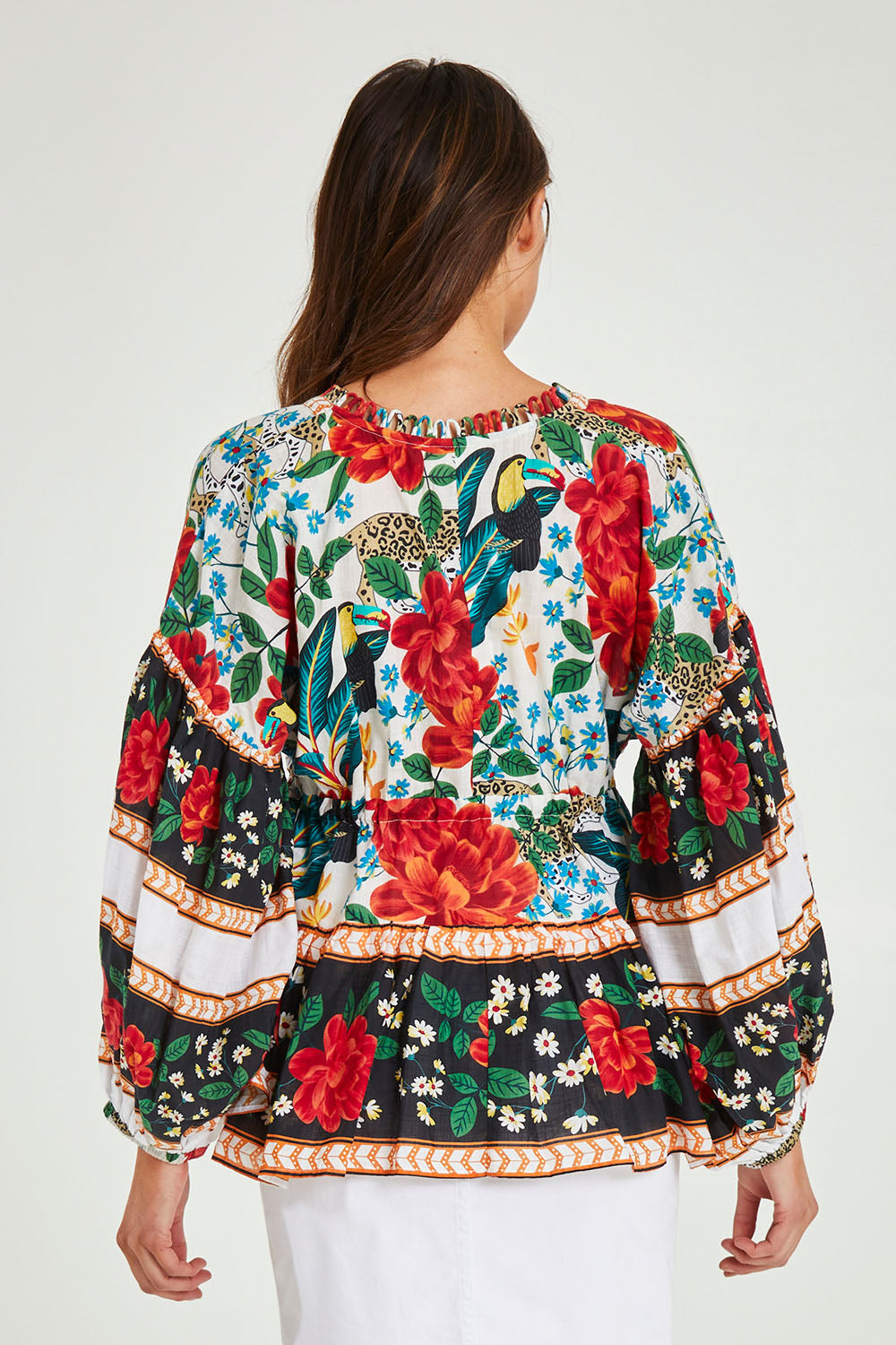 Model Madeline wearing the Cha Cha Top in colour Toledo (Black), from the back