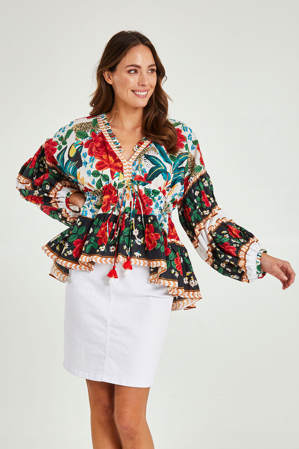 Model Madeline wearing the Cha Cha Top in colour Toledo (Black), from the front, cropped image