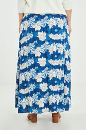 Model Jess wearing size 14 of the Rosie Maxi Skirt in colour Wallflower (Blue), from the back