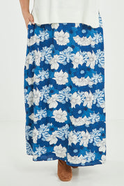 Model Jess wearing size 14 of the Rosie Maxi Skirt in colour Wallflower (Blue), from the front, cropped image
