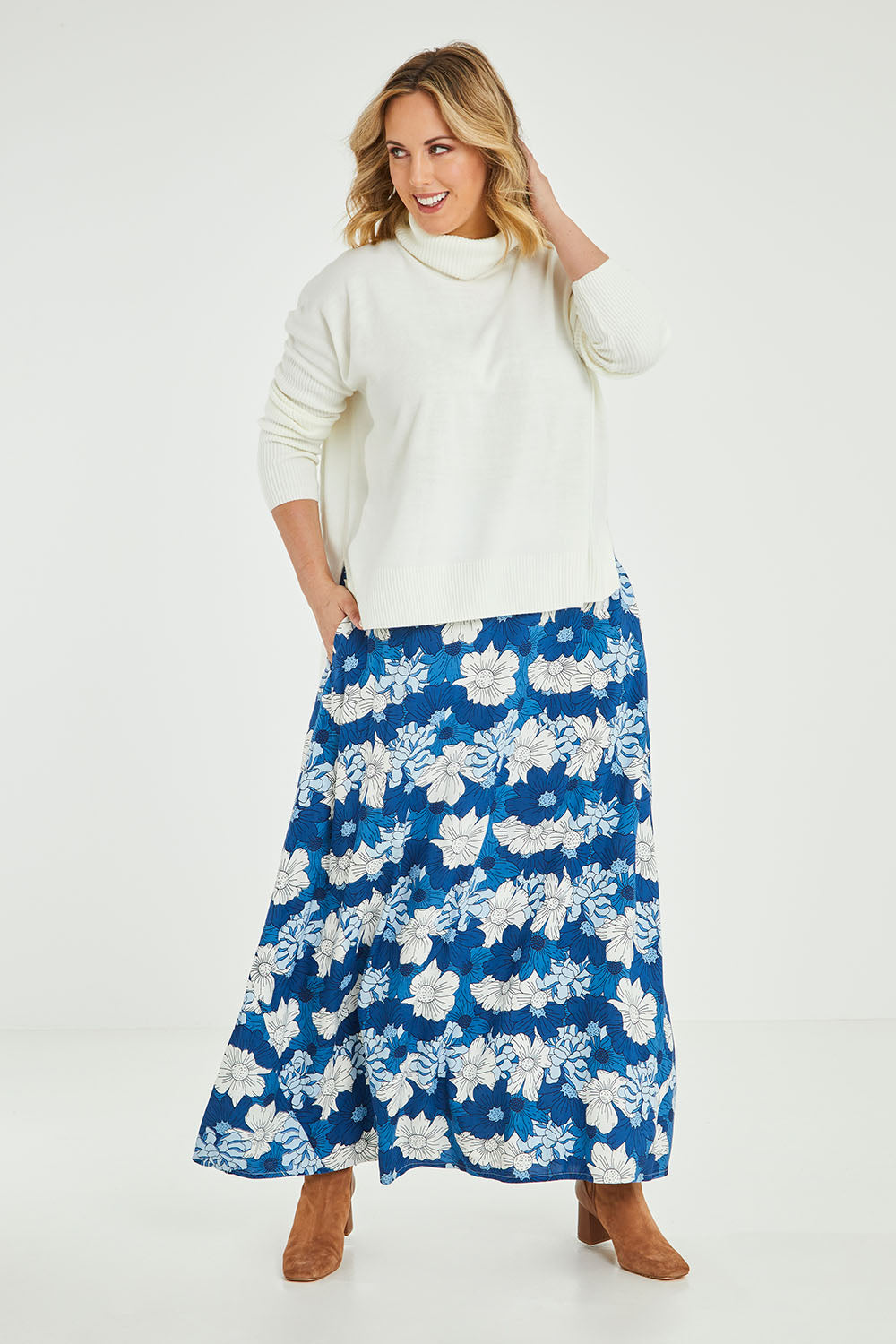 Model Jess wearing size 14 of the Rosie Maxi Skirt in colour Wallflower (Blue), from the front, showing the whole outfit