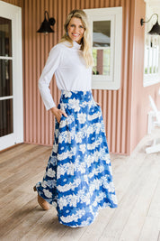 Model Kelly wearing size 10 of the Rosie Maxi Skirt in colour Wallflower (Blue), from the front, showing the whole outfit