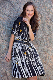 A model wearing the Robbie Shift Dress Birdforest in colour Black (Black), from the front, showing the whole outfit