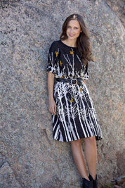 A model wearing the Robbie Shift Dress Birdforest in colour Black (Black), from the front, showing the whole outfit