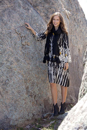 A model wearing the Robbie Shift Dress Birdforest in colour Black (Black), from the front, showing the whole outfit