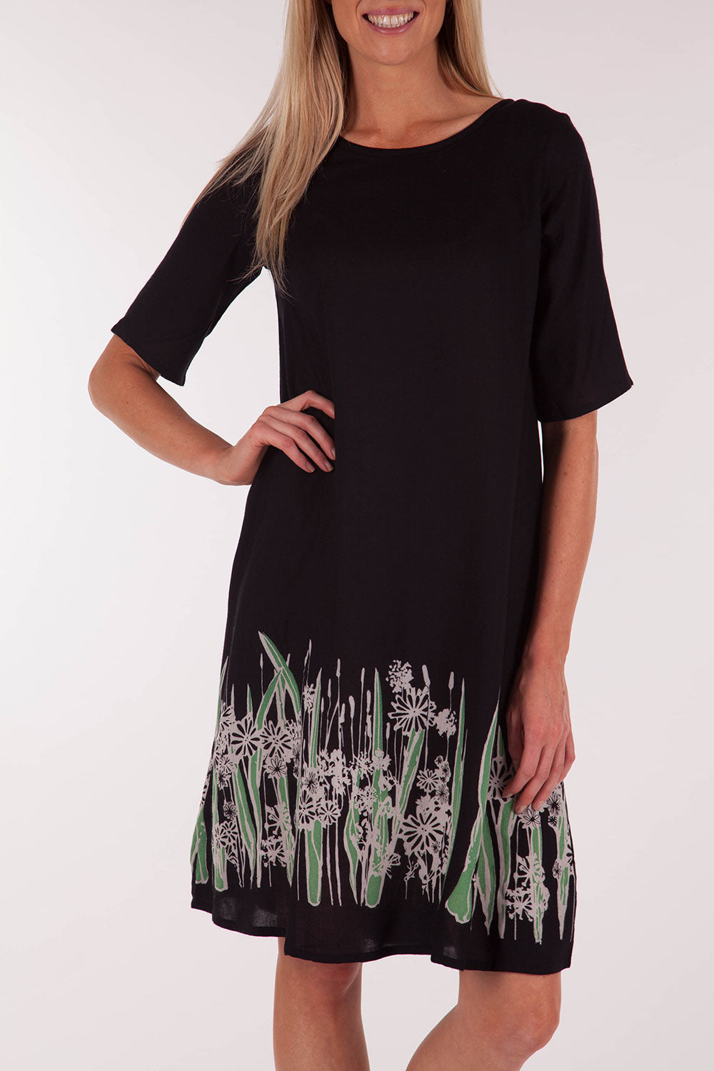 A model wearing size 10 of the Robbie Shift Dress Summer Meadow in colour JetBlack (Black), from the front, cropped image