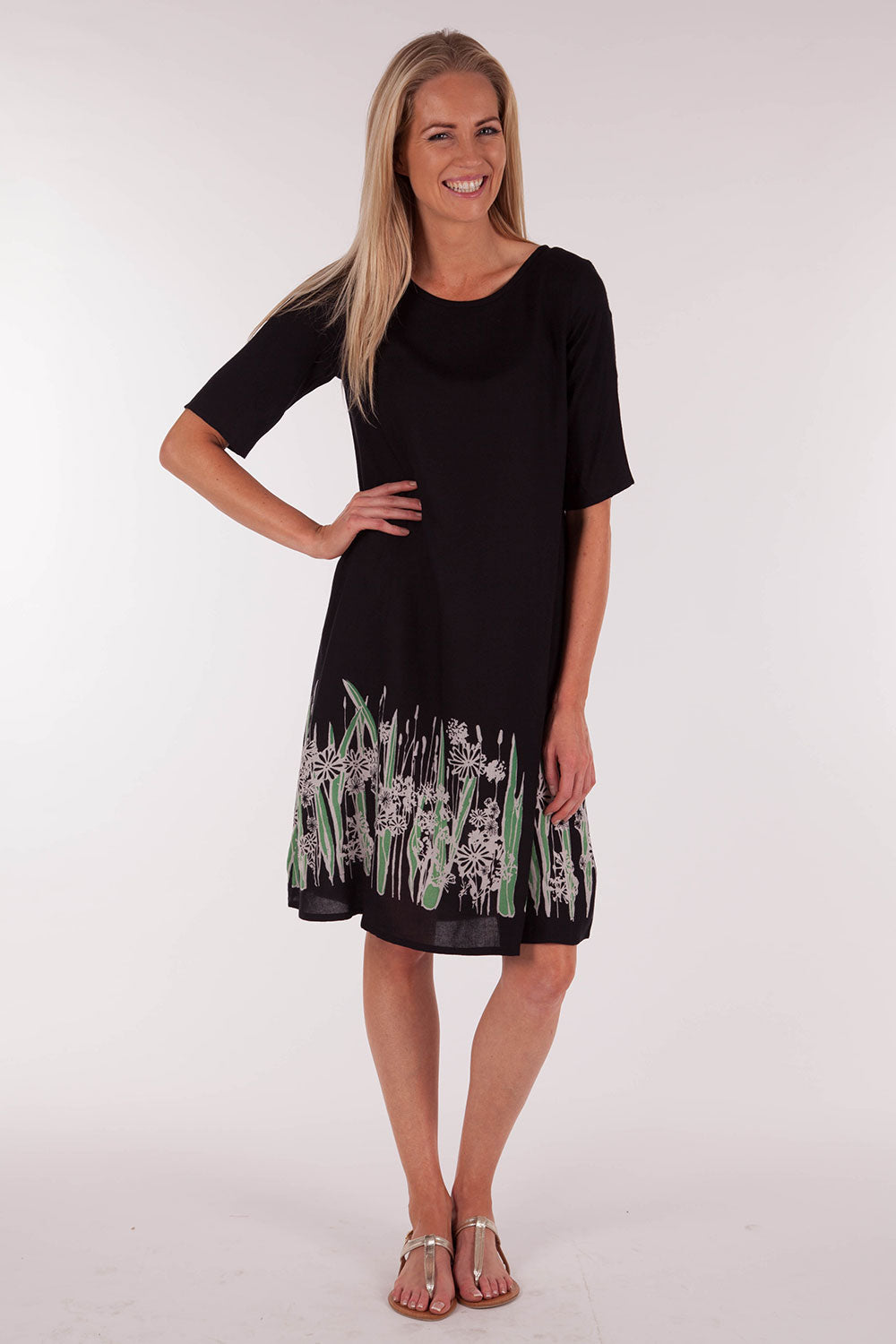 A model wearing size 10 of the Robbie Shift Dress Summer Meadow in colour JetBlack (Black), from the front, showing the whole outfit