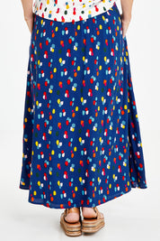 Model Laura wearing size 14 of the Rose Maxi Skirt in colour Speckled (Blue), from the back