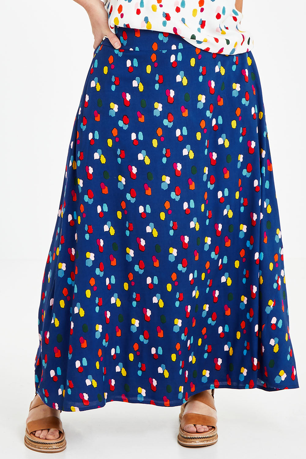 Model Laura wearing size 14 of the Rose Maxi Skirt in colour Speckled (Blue), from the front, cropped image