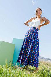 Model Vitoria wearing size 10 of the Rose Maxi Skirt in colour Speckled (Blue), from the front, showing the whole outfit