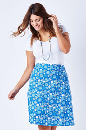 Model Laura wearing size 12 of the Adele Ain colourline Skirt Fruit Punch - Blue (Blue), from the front, cropped image