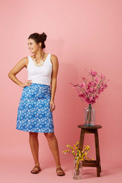 Model Rebecca wearing size 10 of the Adele Ain colourline Skirt Fruit Punch - Blue (Blue), from the front, showing the whole outfit
