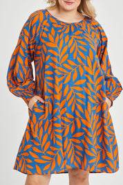 Model Keeara wearing size 16 of the Frankie Shift Dress in colour Leaf, from the front, cropped image
