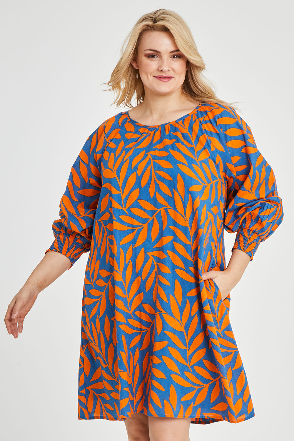 Model Keeara wearing size 16 of the Frankie Shift Dress in colour Leaf, from the front, cropped image