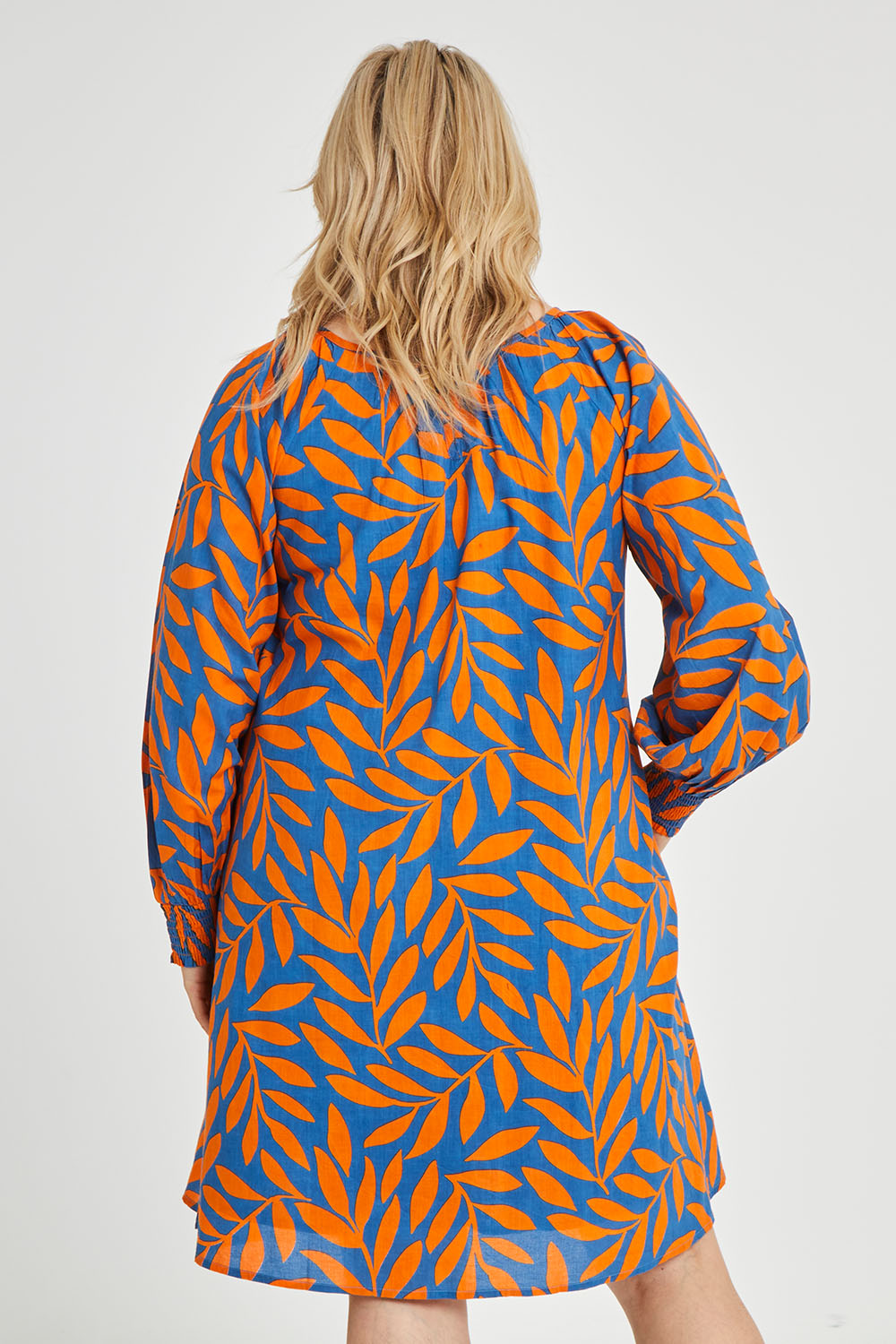 Model Keeara wearing size 16 of the Frankie Shift Dress in colour Leaf, from the front, cropped image