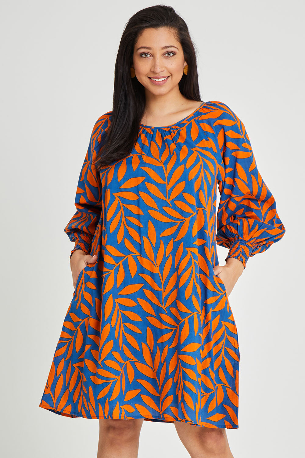 Model Terri-Leigh wearing size 14 of the Frankie Shift Dress in colour Leaf, from the front, cropped image