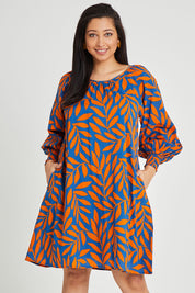 Model Terri-Leigh wearing size 14 of the Frankie Shift Dress in colour Leaf, from the front, cropped image