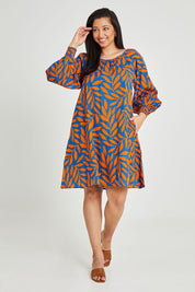 Model Terri-Leigh wearing size 14 of the Frankie Shift Dress in colour Leaf, from the front, showing the whole outfit