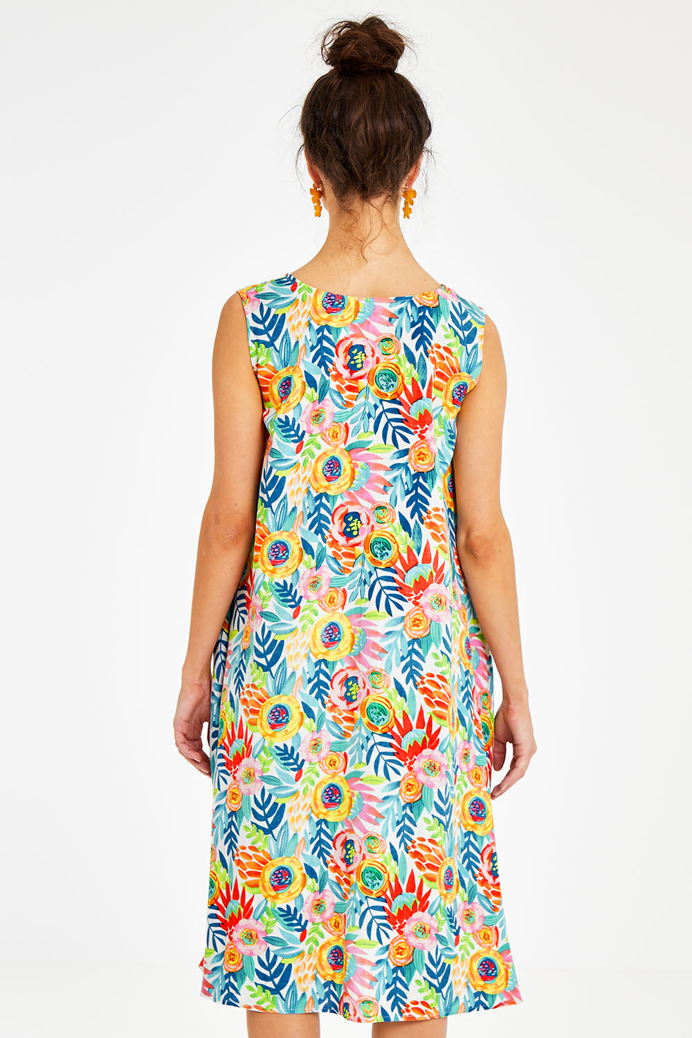 Model Courtney wearing size 10 of the Zoey Shift Dress in colour Meadow (Blue), from the back