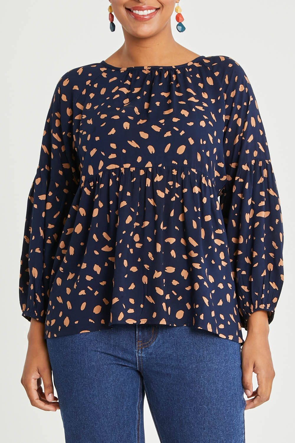 Model Noli wearing size 14 of the Dianna Blouse in colour Spot (Blue), from the front, cropped image