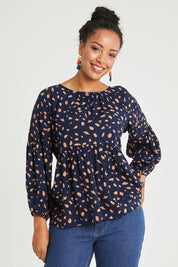 Model Noli wearing size 14 of the Dianna Blouse in colour Spot (Blue), from the front, cropped image