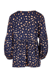 Product shot of the Dianna Blouse in colour Spot (Blue), from the back