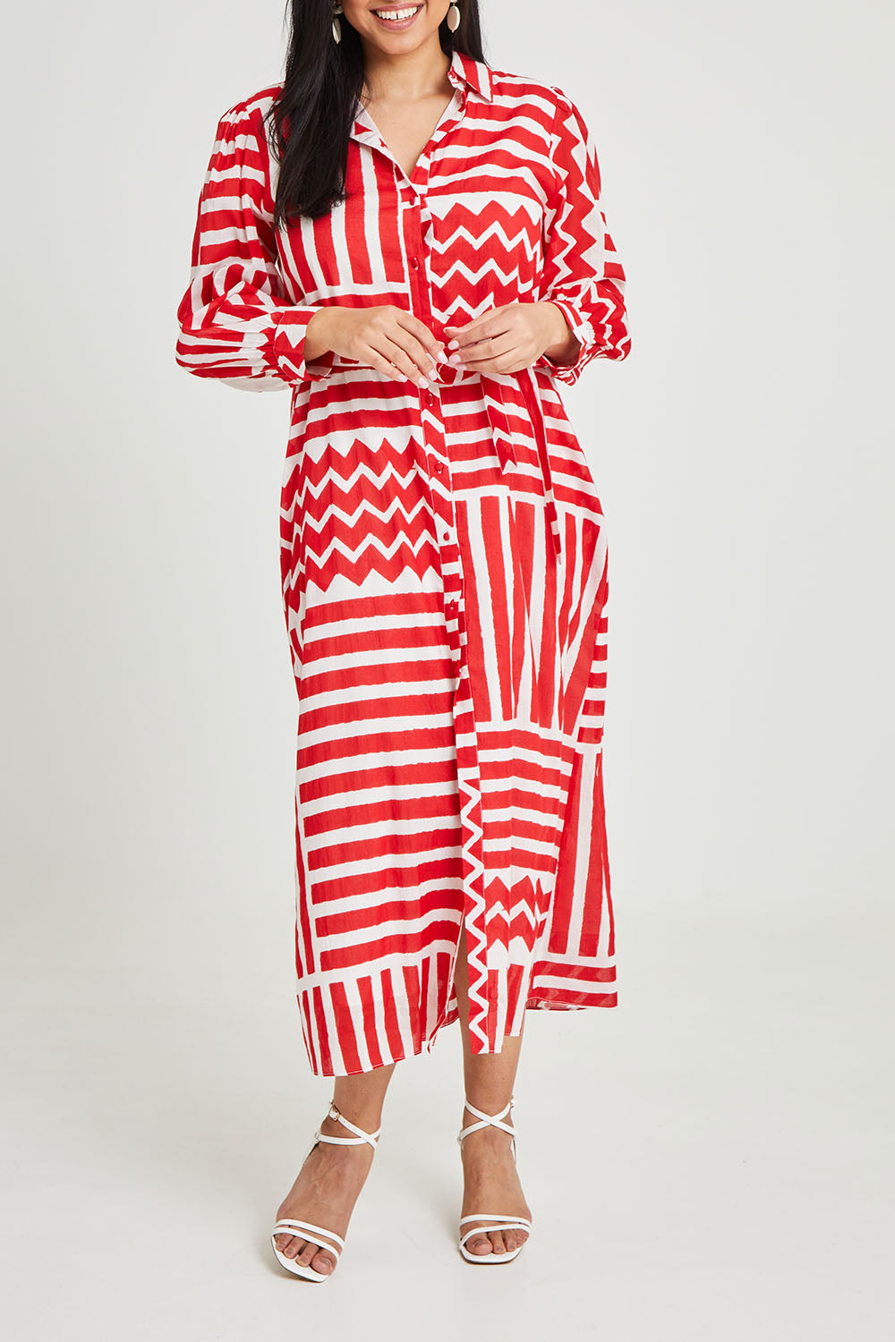 Model Terri-Leigh wearing size 14 of the Abby Shirt Dress in colour Patchwork (Red), from the front, cropped image