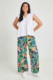Model Terri-Leigh wearing size 14 of the Stella Print Pant in colour Rainforest (Blue), from the front, showing the whole outfit