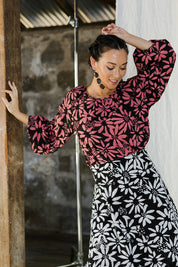 Model Katie wearing size 10 of the Jess Blouse in colour Flower (Black), from the front, cropped image