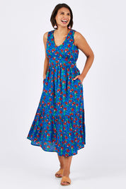 Model Thais wearing size 10 of the Scarlet Summer Dress Kaleidoscope in colour Blue (Blue), from the front, showing the whole outfit