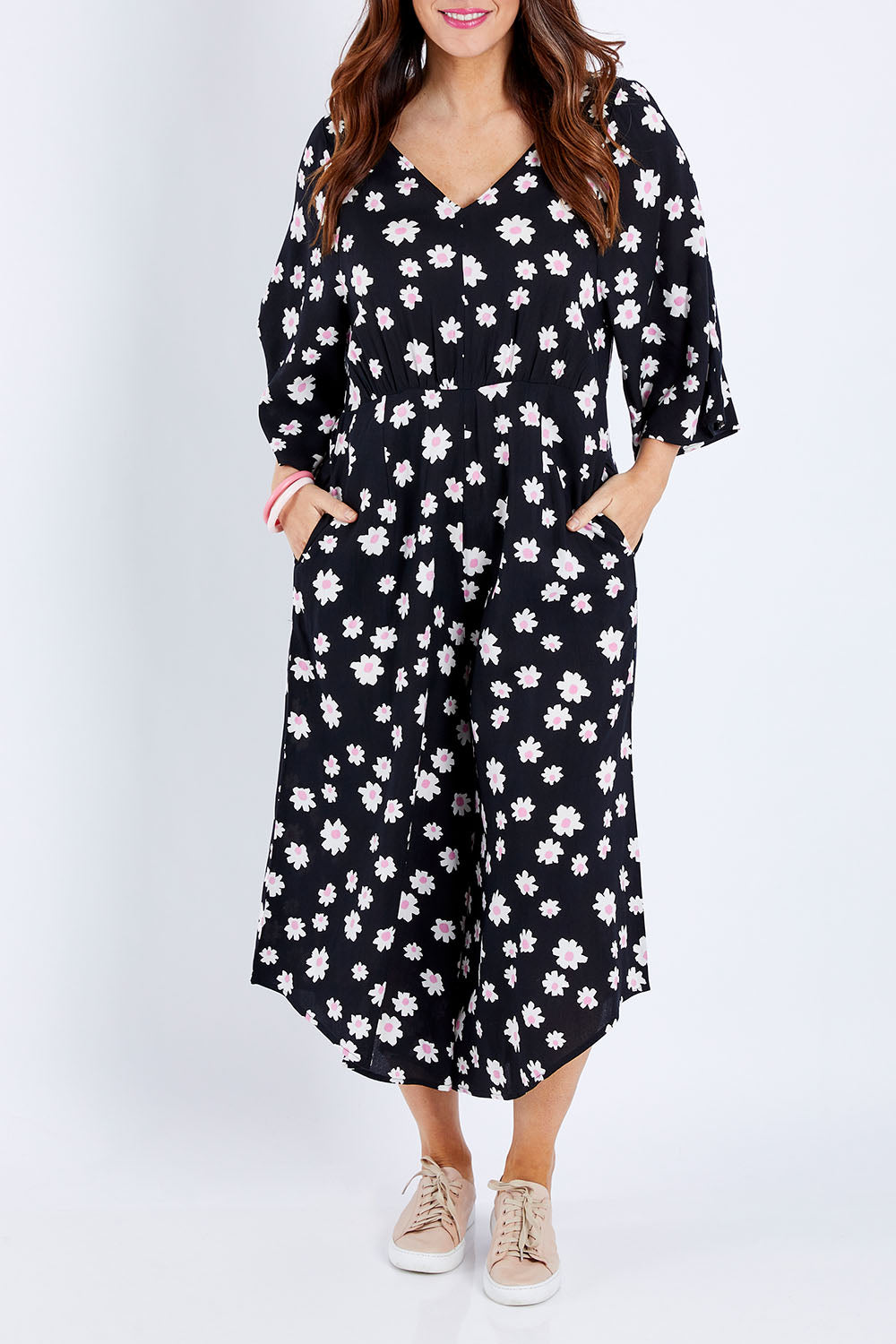 Model Laura wearing size 14 of the Savanna Kimono Jumpsuit in colour Daisychain (Blue), from the front, cropped image