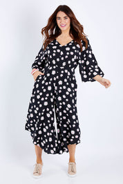 Model Laura wearing size 14 of the Savanna Kimono Jumpsuit in colour Daisychain (Blue), from the front, showing the whole outfit