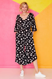 Model Veronica wearing size 10 of the Savanna Kimono Jumpsuit in colour Daisychain (Blue), from the front, showing the whole outfit