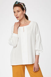 A model wearing the Benetta Blouse in colour White (White), from the front, cropped image