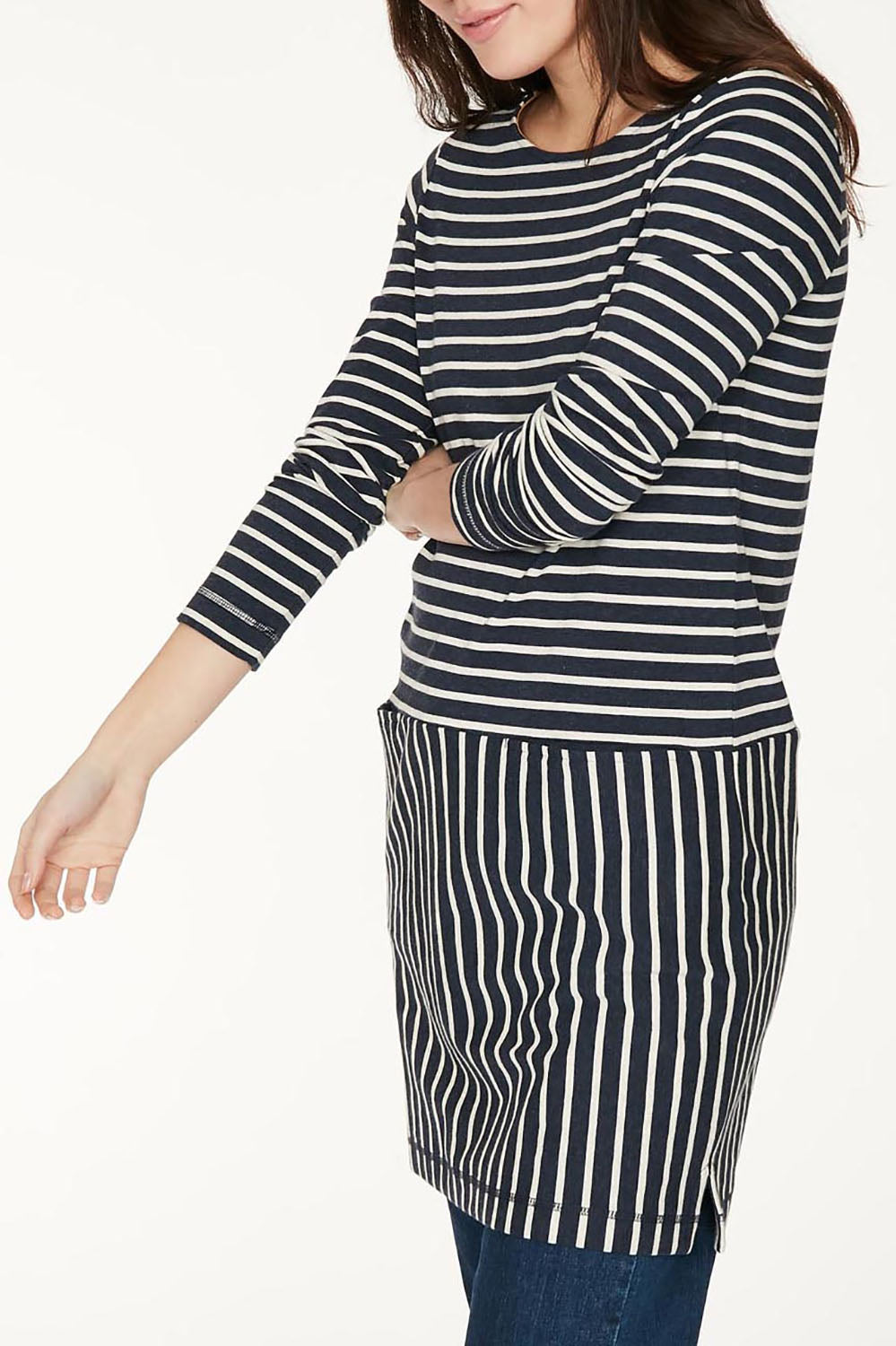A model wearing the Hester Tunic Dress in colour Midnight (Blue), from the front, cropped image