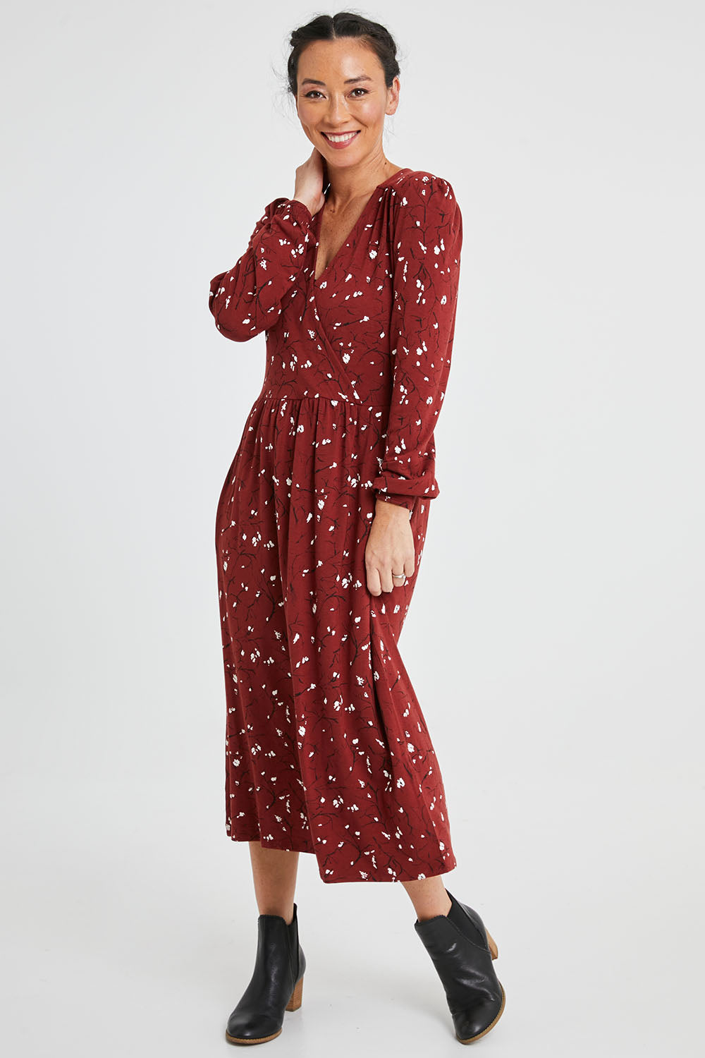 Model Katie wearing size 10 of the Eria Bamboo Wrap Dress in colour Oranrust (Red), from the front, showing the whole outfit