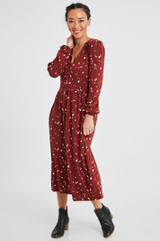 Model Katie wearing size 10 of the Eria Bamboo Wrap Dress in colour Oranrust (Red), from the front, showing the whole outfit