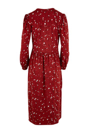 Product shot of the Eria Bamboo Wrap Dress in colour Oranrust (Red), from the back