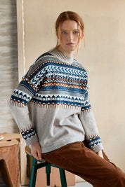 A model wearing the Delilah Fairisle Jumper in colour Vanilla (White), from the front, showing the whole outfit