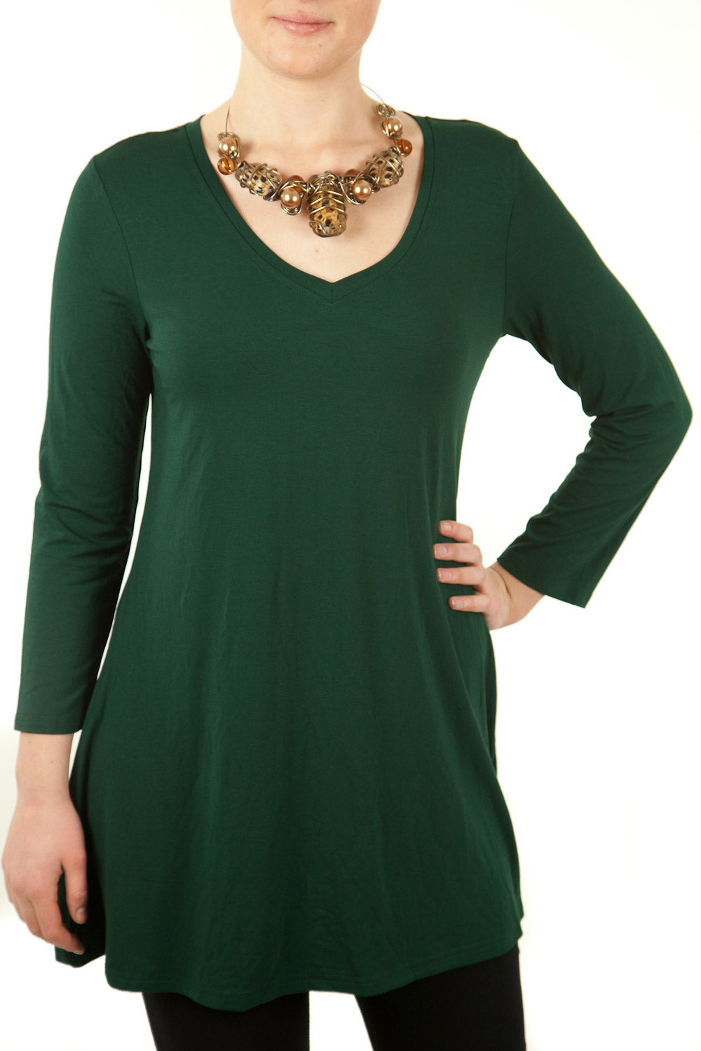 A model wearing the V Neck Long Tunic in colour Green (Green), from the front, cropped image