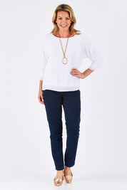 Model Louise wearing size S of the Layer Top in colour White (White), from the front, showing the whole outfit