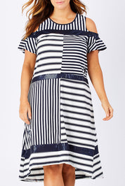 Model Laura wearing size M of the Star Stripe Dress in colour NavyWhite (Blue), from the front, cropped image