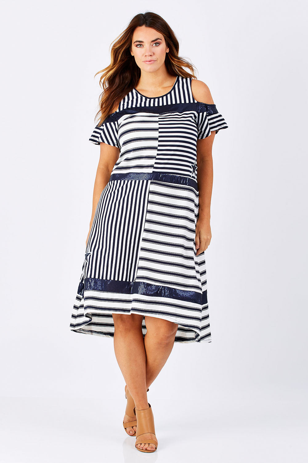 Model Laura wearing size M of the Star Stripe Dress in colour NavyWhite (Blue), from the front, showing the whole outfit